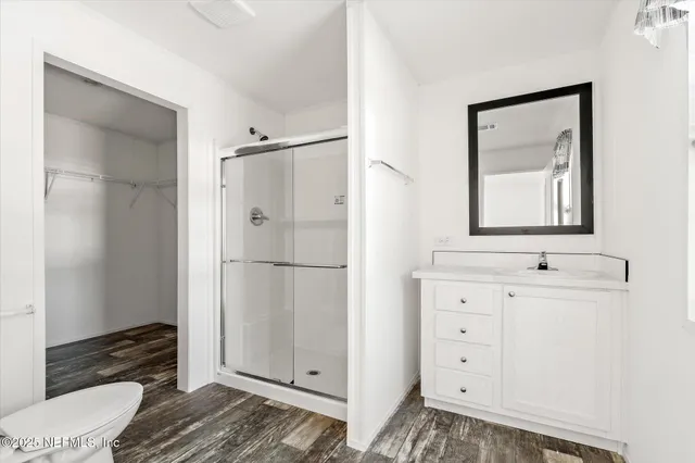 a kitchen with stainless steel appliances a sink and a refrigerator
