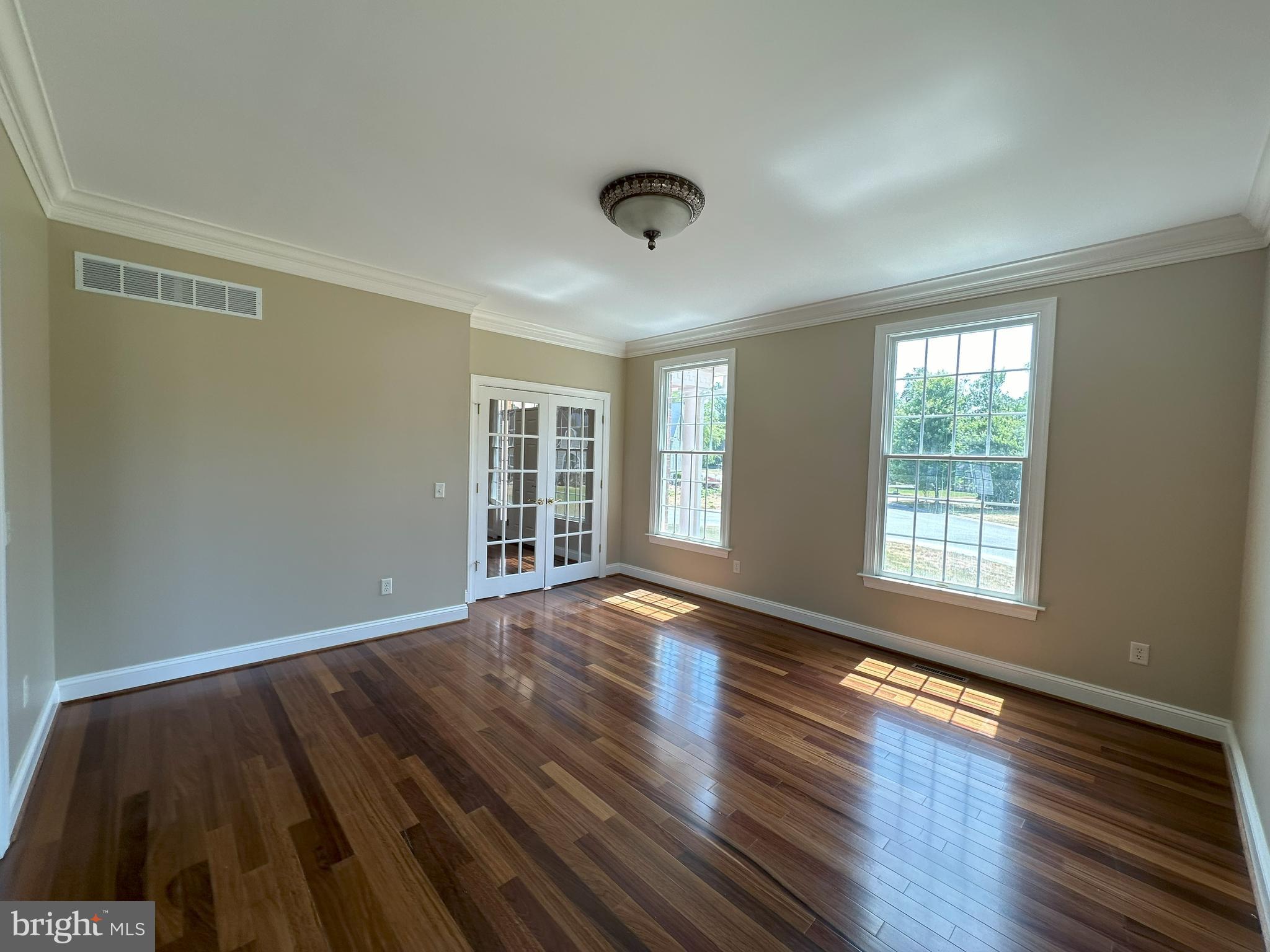 564 Brookfield Drive Dover, DE 19901 - Photo 13 of 25 a view of an empty room with wooden floor and a window