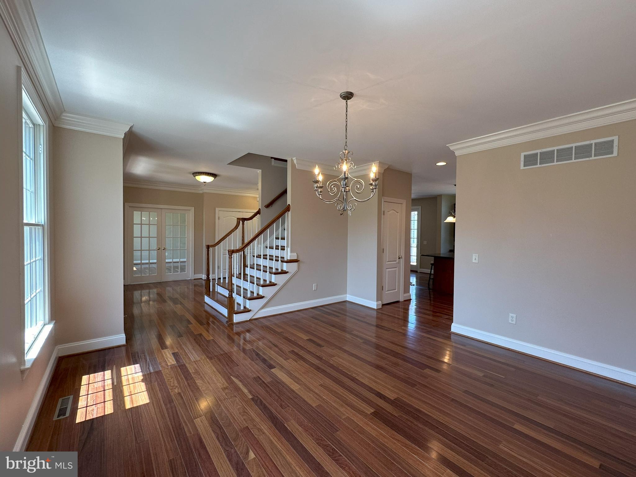 564 Brookfield Drive Dover, DE 19901 - Photo 14 of 25 a view of a room with wooden floor staircase and a kitchen