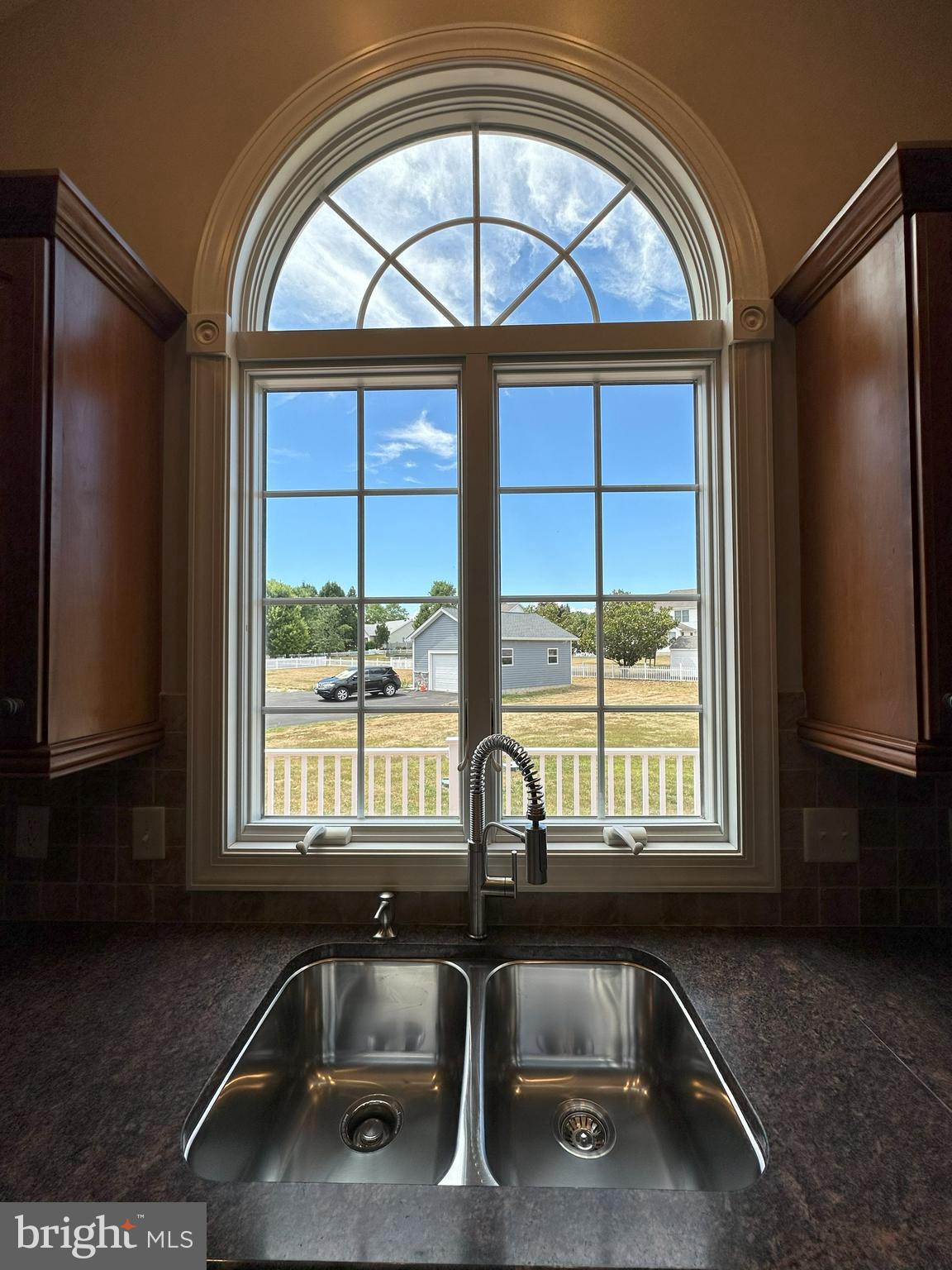 564 Brookfield Drive Dover, DE 19901 - Photo 17 of 25 a kitchen with a sink a washer and dryer next to a window