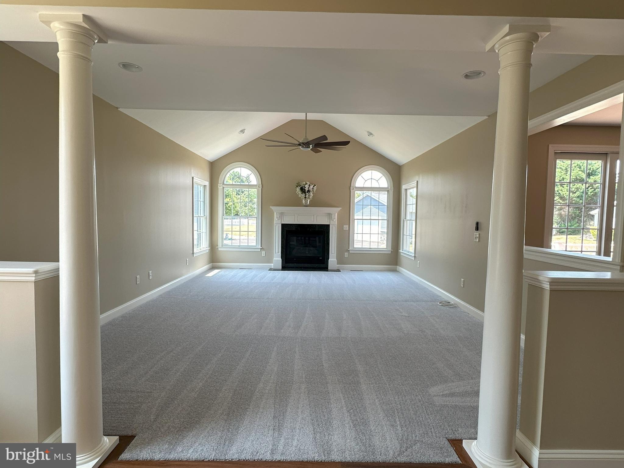 564 Brookfield Drive Dover, DE 19901 - Photo 19 of 25 a view of an empty room with a fireplace and a window