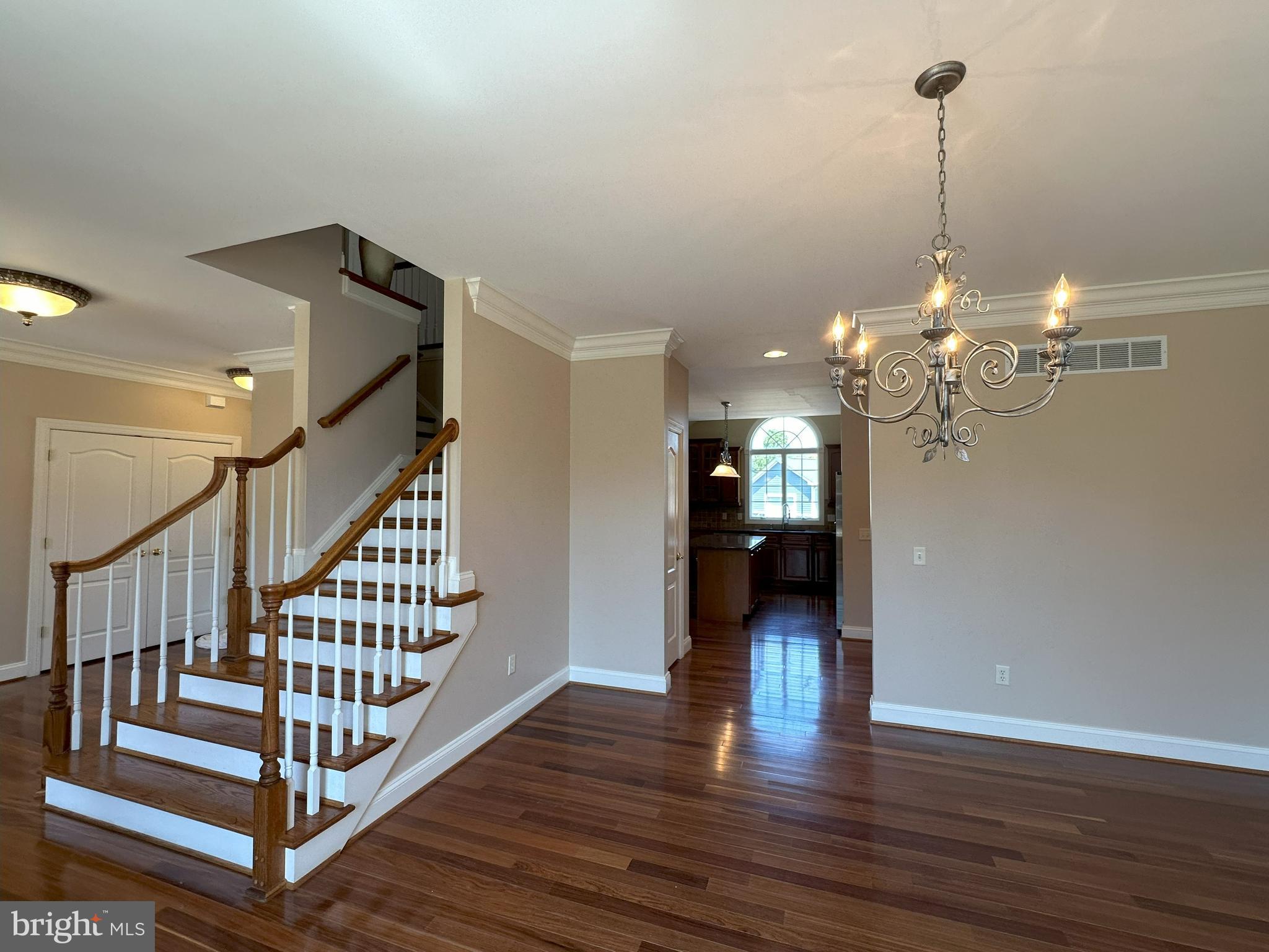 564 Brookfield Drive Dover, DE 19901 - Photo 6 of 25 a view of a hallway with wooden floor and staircase