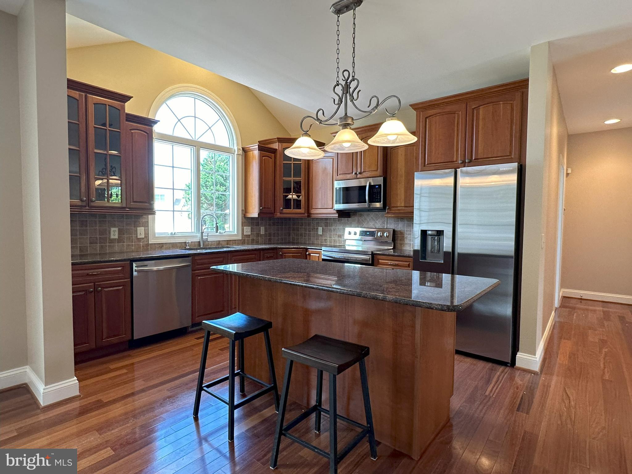 564 Brookfield Drive Dover, DE 19901 - Photo 7 of 25 a kitchen with stainless steel appliances granite countertop a sink a stove and a refrigerator