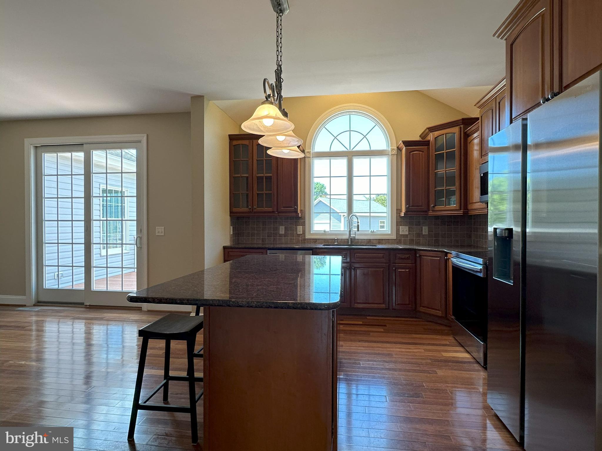 564 Brookfield Drive Dover, DE 19901 - Photo 8 of 25 a kitchen with stainless steel appliances granite countertop a stove a sink and a refrigerator