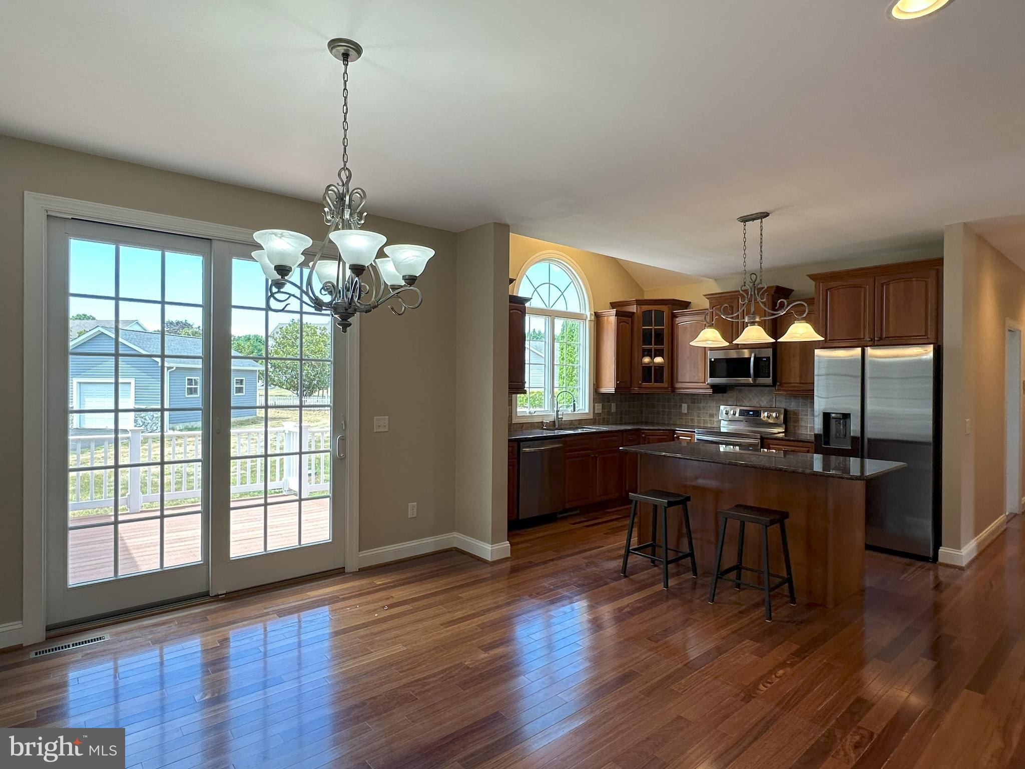 564 Brookfield Drive Dover, DE 19901 - Photo 10 of 25 a dining room with furniture a chandelier and wooden floor