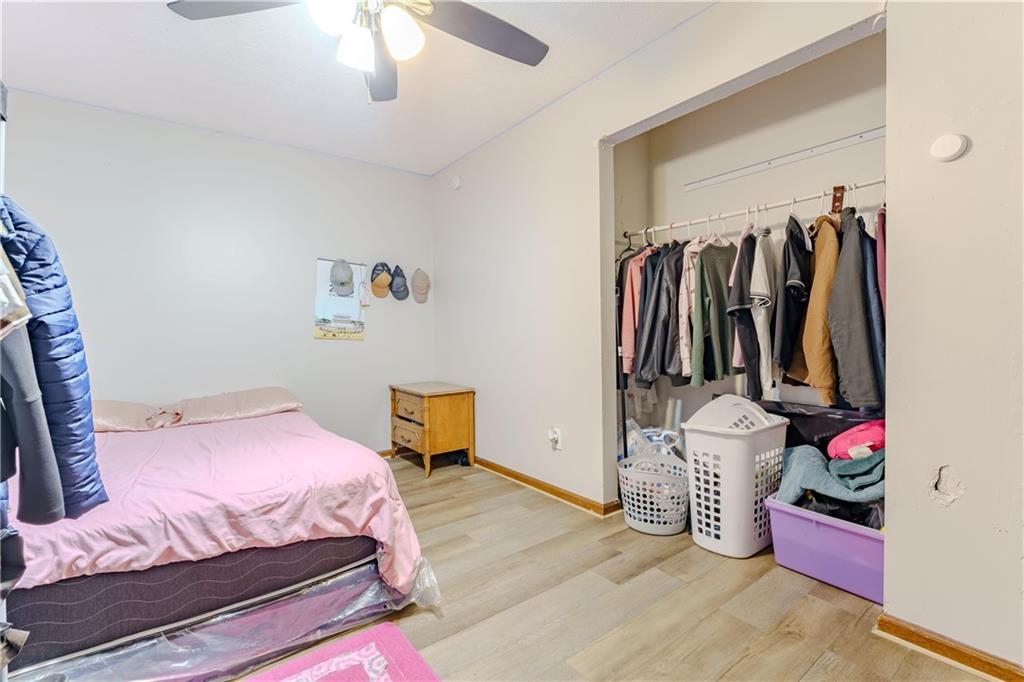 6543 Sage Street Atlanta, GA 30340 - Photo 12 of 18 a bedroom with a bed and a walk in closet