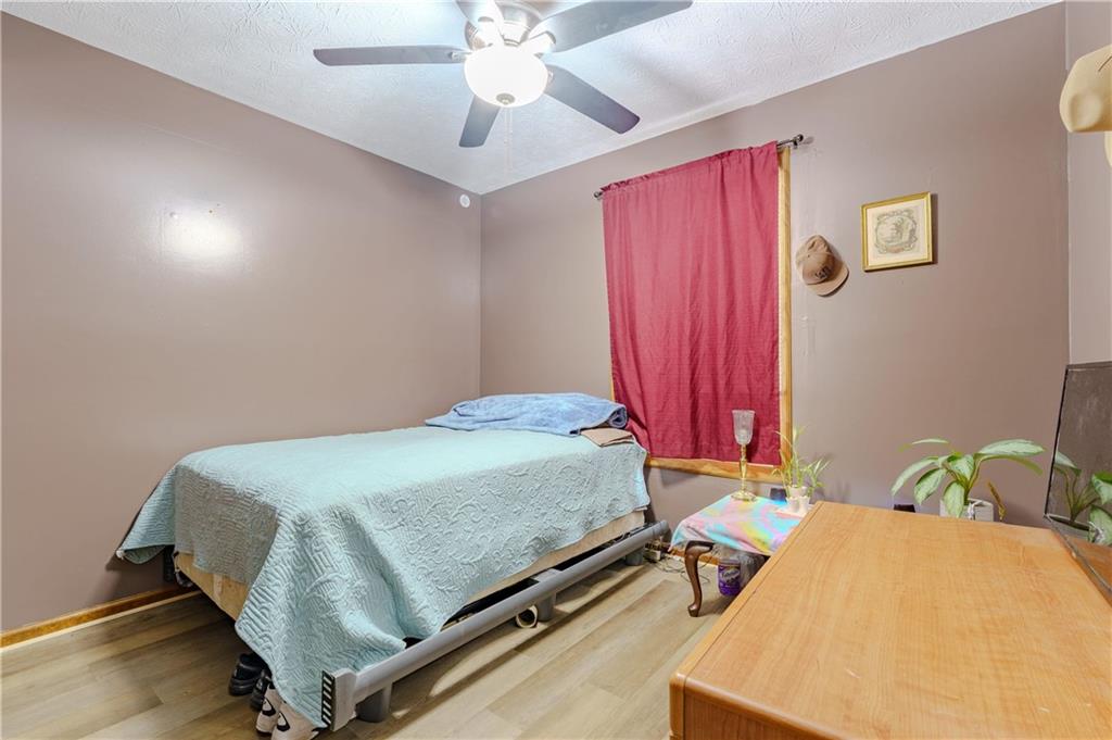 6543 Sage Street Atlanta, GA 30340 - Photo 13 of 18 a bed sitting in a bedroom next to a window