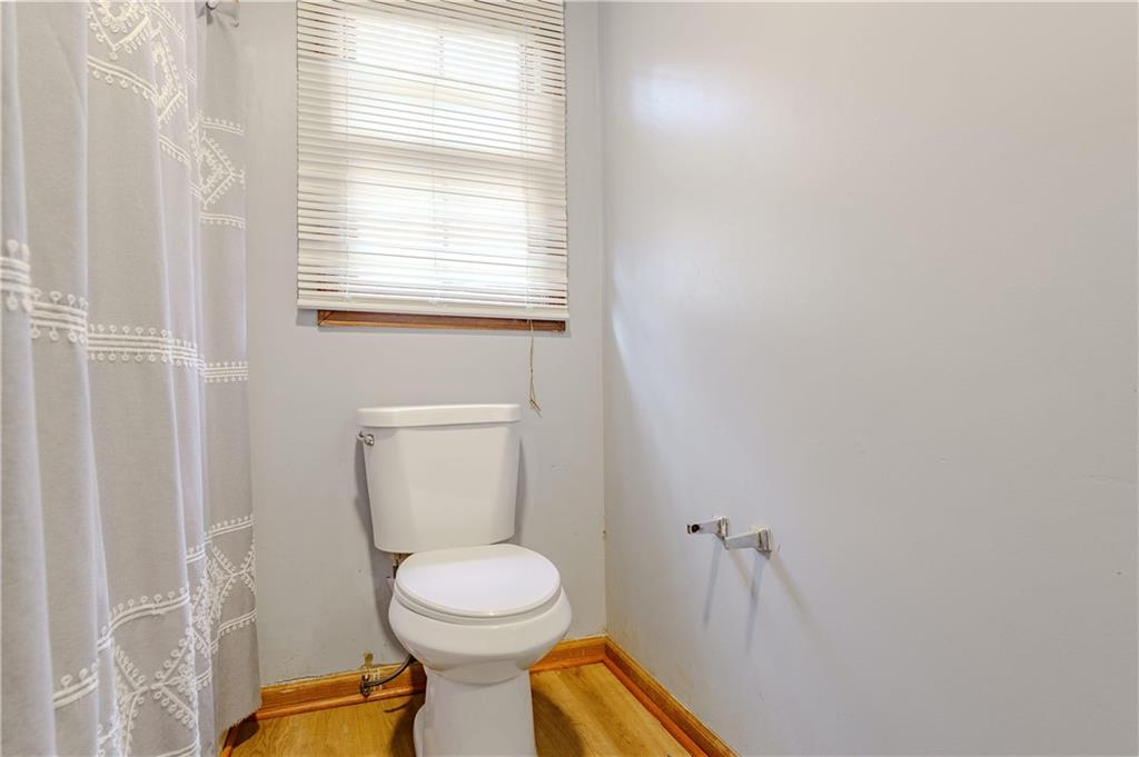 6543 Sage Street Atlanta, GA 30340 - Photo 15 of 18 a bathroom with a toilet and a sink