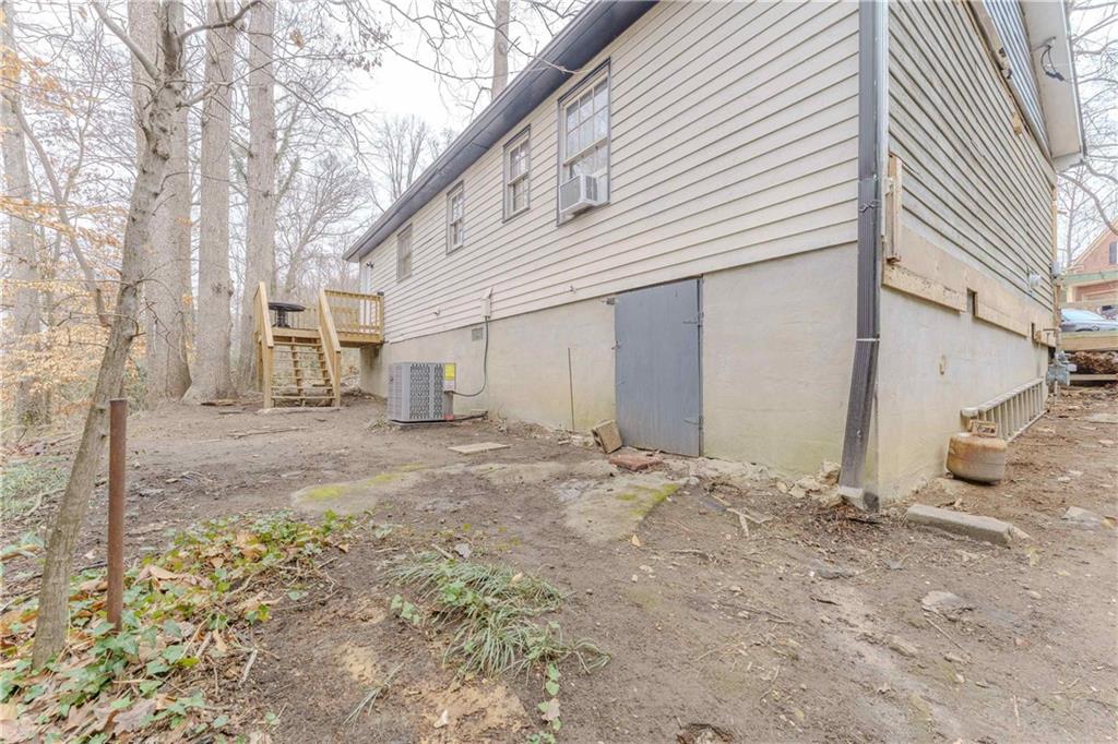 6543 Sage Street Atlanta, GA 30340 - Photo 17 of 18 a view of a house with a snow in the yard