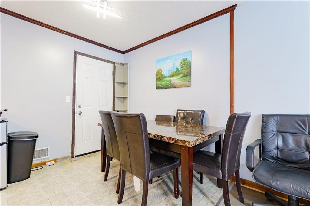 6543 Sage Street Atlanta, GA 30340 - Photo 5 of 18 a view of a dining room with furniture