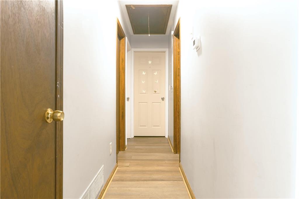 6543 Sage Street Atlanta, GA 30340 - Photo 8 of 18 a view of a hallway with wooden floor