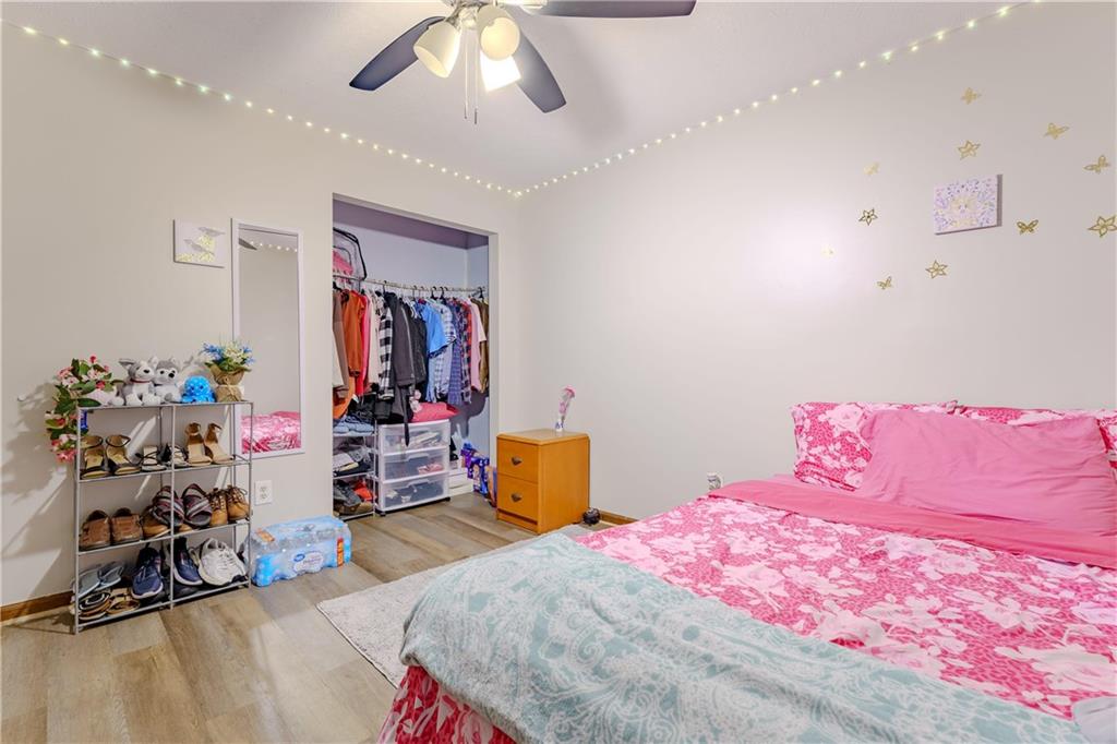 6543 Sage Street Atlanta, GA 30340 - Photo 10 of 18 a bedroom with a bed and wooden floor