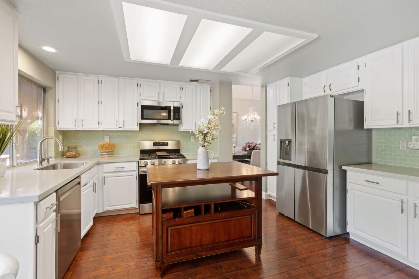 3335 Sandalwood Road Rocklin, CA 95765 - Photo 13 of 30 a kitchen with stainless steel appliances a refrigerator stove microwave and sink