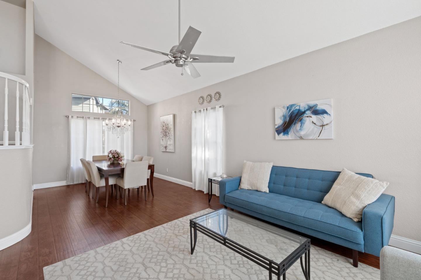 3335 Sandalwood Road Rocklin, CA 95765 - Photo 7 of 30 a living room with furniture a wooden floor and a chandelier
