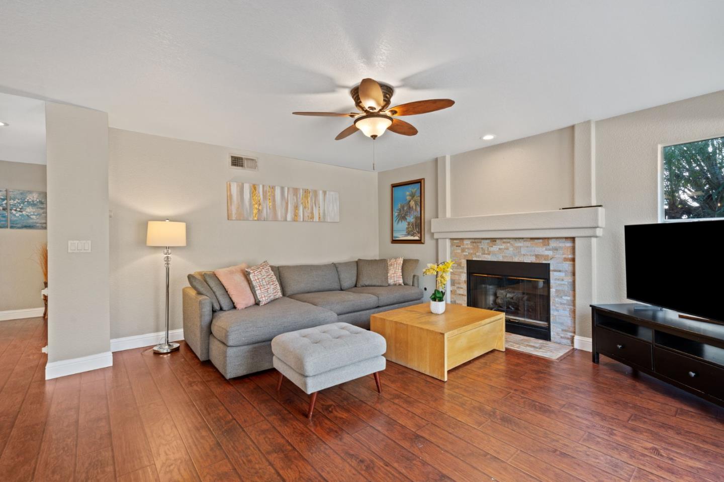 3335 Sandalwood Road Rocklin, CA 95765 - Photo 10 of 30 a living room with furniture a flat screen tv and a fireplace