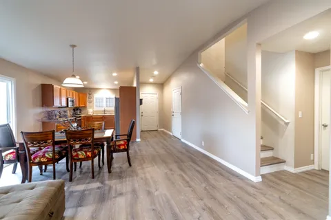 a view of a dining room with furniture and chandelier