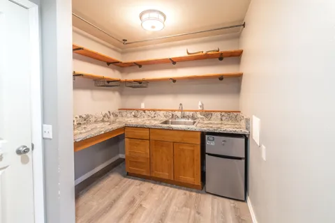 a view of cabinets and wooden floor