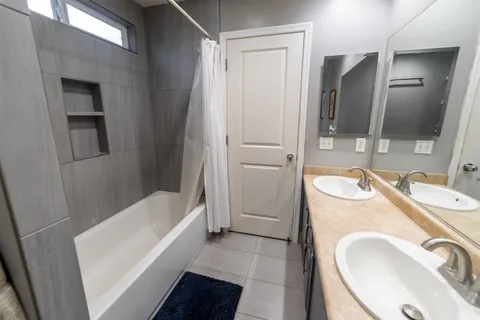 a bathroom with a sink a washer and dryer