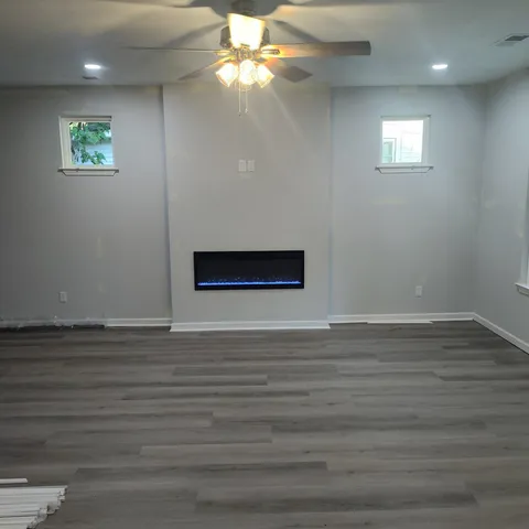 a view of a kitchen with a sink a kitchen microwave and a refrigerator