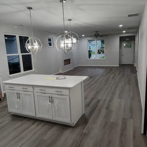 a view of an house with backyard space and garden