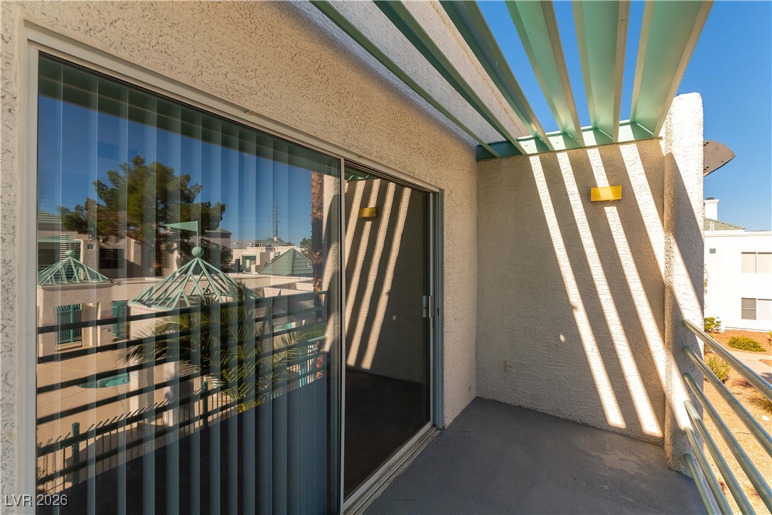 7100 West Pirates Cove Road, Unit 2089 Las Vegas, NV 89145 - Photo 21 of 32 BALCONY WITH VIEW OF POOL