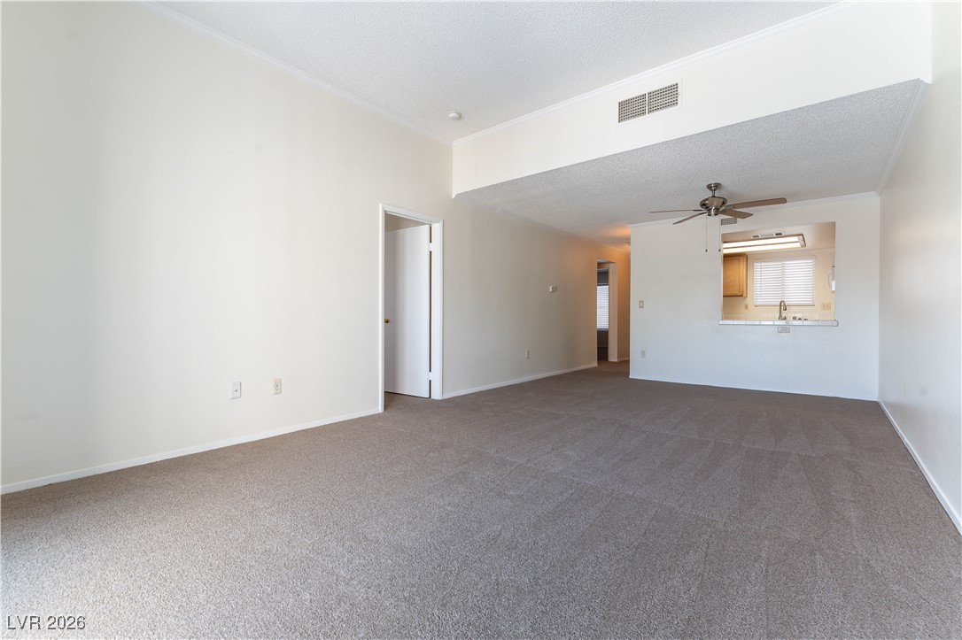 7100 West Pirates Cove Road, Unit 2089 Las Vegas, NV 89145 - Photo 5 of 32 VIEW INTO KITCHEN AND DINING AREA