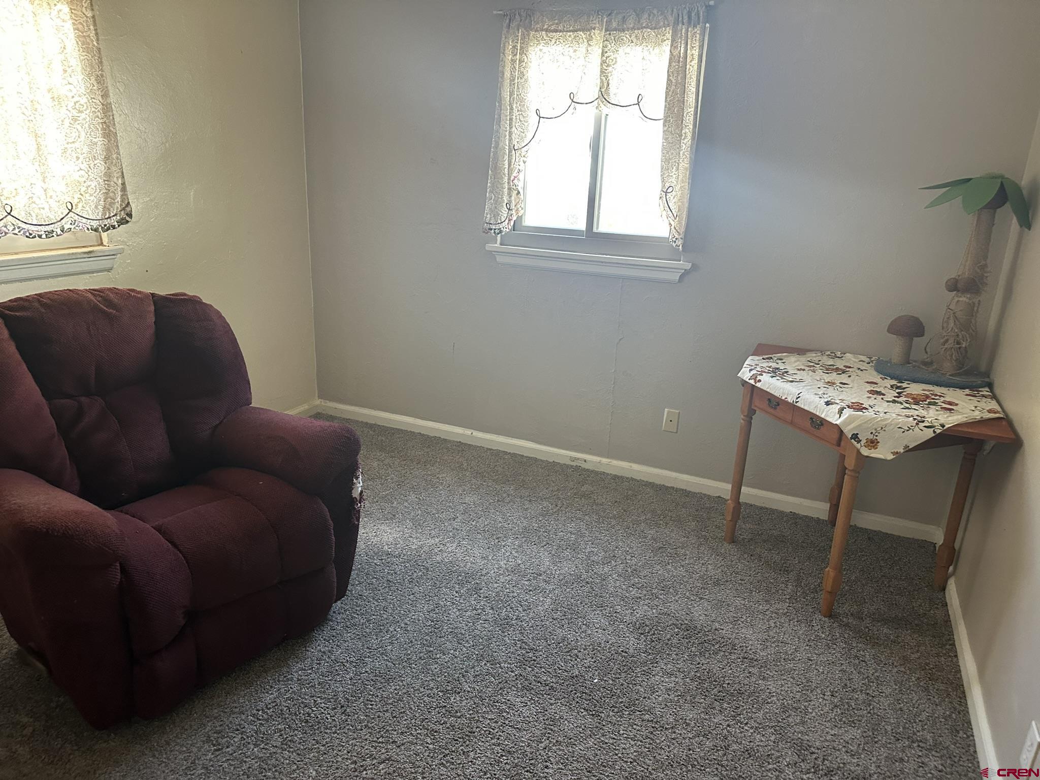 435 South Elm Street Cortez, CO 81321 - Photo 10 of 17 a living room with furniture and a window
