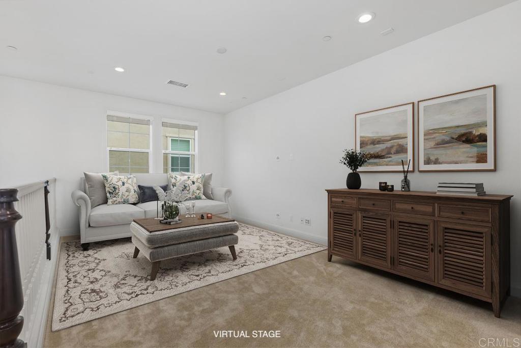 2527 Wellspring Street Carlsbad, CA 92010 - Photo 13 of 28 a living room with furniture and a dresser