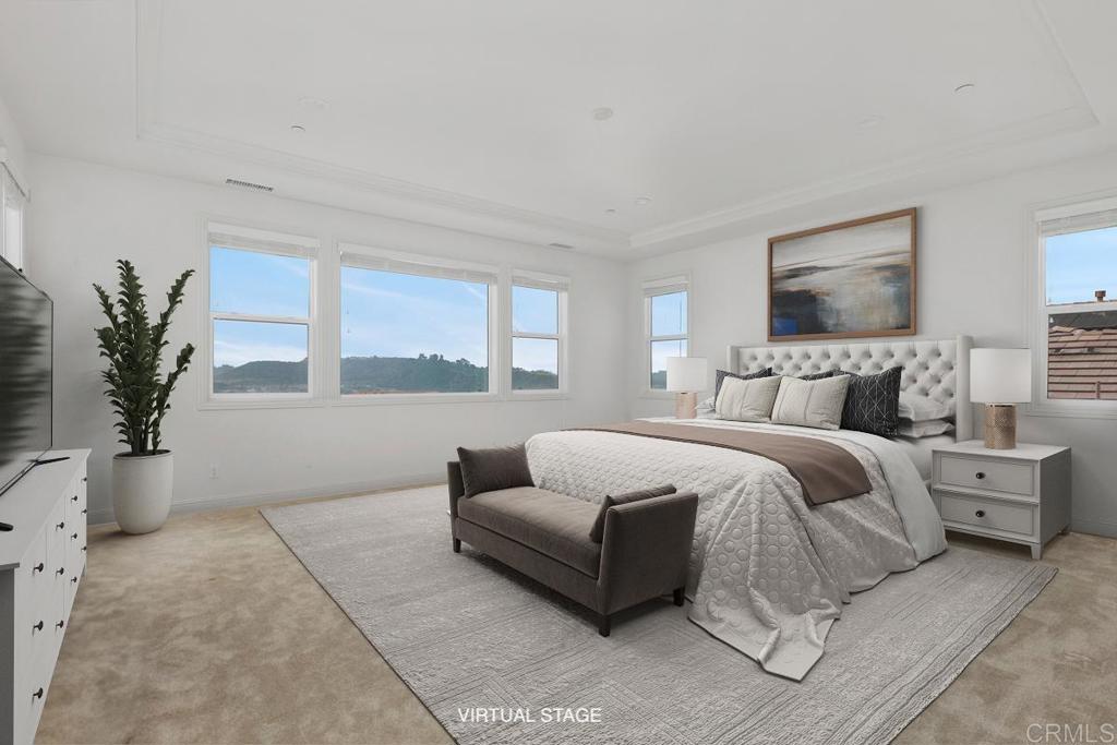 2527 Wellspring Street Carlsbad, CA 92010 - Photo 14 of 28 a bedroom with a balcony a bed and a couch