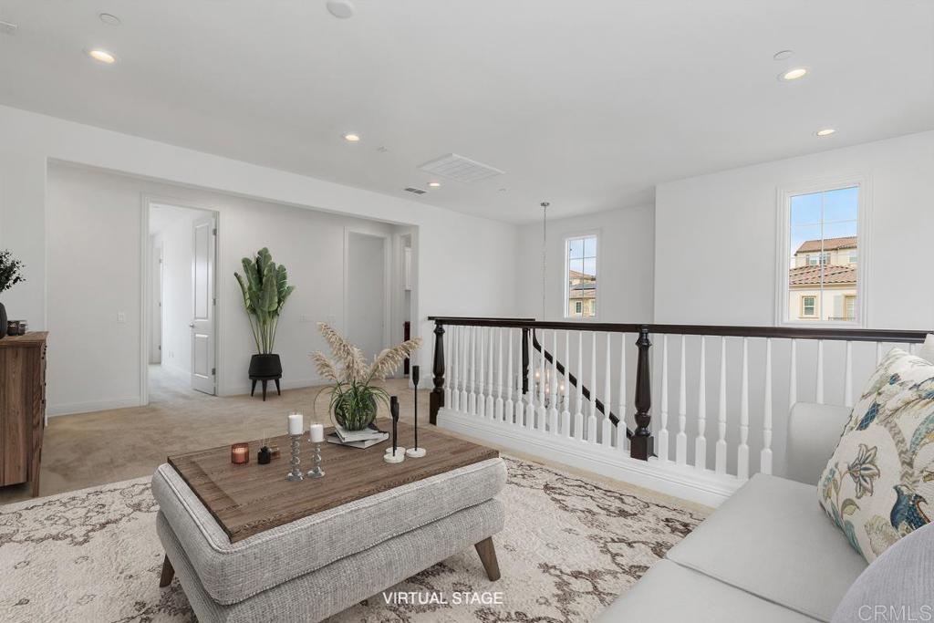 2527 Wellspring Street Carlsbad, CA 92010 - Photo 17 of 28 a living room with furniture and wooden floor