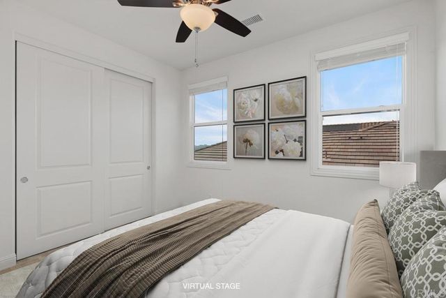 a bedroom with a large bed and a window