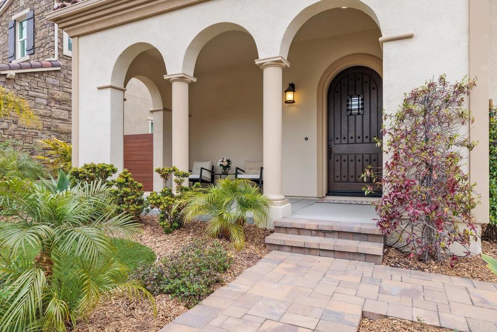 2527 Wellspring Street Carlsbad, CA 92010 - Photo 20 of 28 a front view of a house with garden