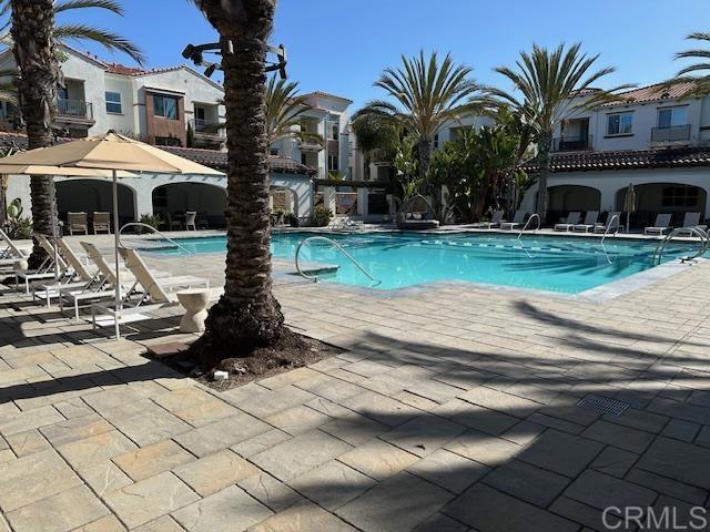 2527 Wellspring Street Carlsbad, CA 92010 - Photo 25 of 28 a front view of a house with garden