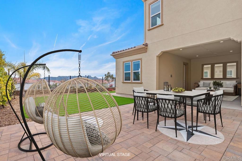 2527 Wellspring Street Carlsbad, CA 92010 - Photo 3 of 28 a view of a dining room with furniture and chandelier