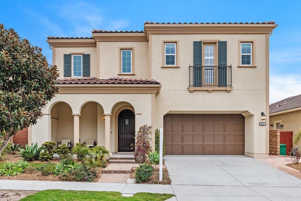 2527 Wellspring Street Carlsbad, CA 92010 - Photo 6 of 28 a front view of a house with garden