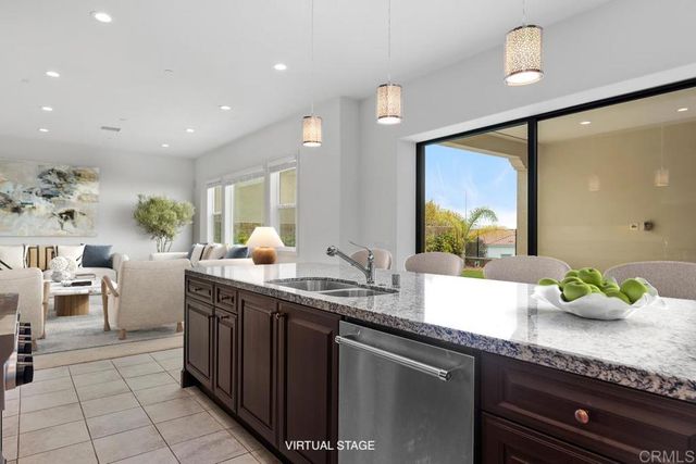 a spacious bathroom with a granite countertop sink a toilet and a mirror