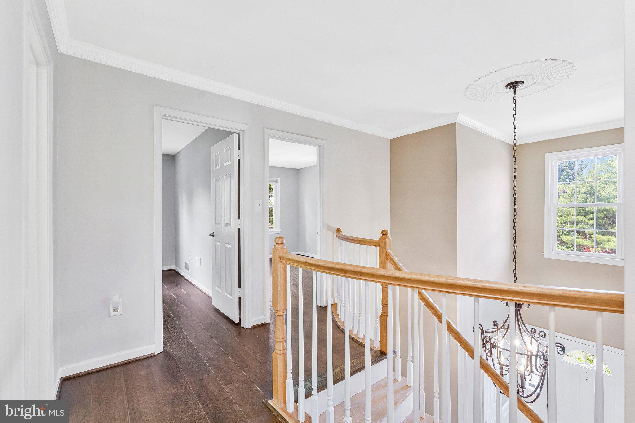 2000 Gallows Tree Lane Vienna, VA 22182 - Photo 21 of 58 a view of a hallway with wooden floor and stairs