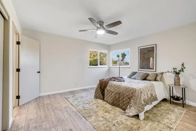 a bedroom with a large bed and a window