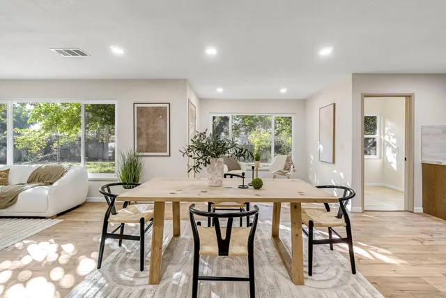 a view of a dining room with furniture window and outside view