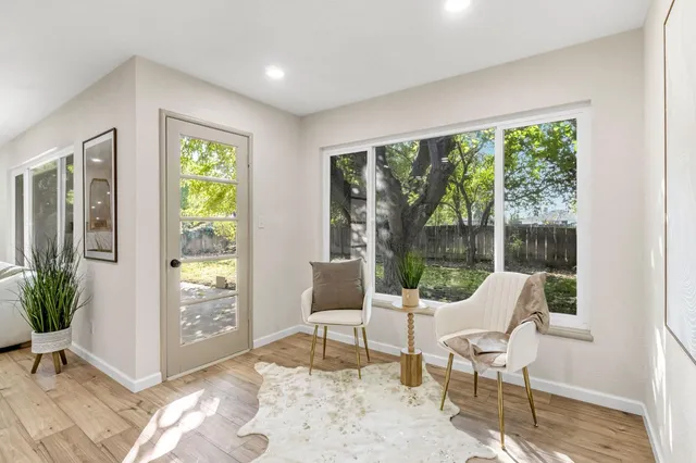 a living room with furniture and a window
