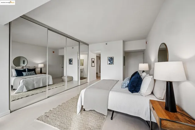 a bedroom with bed and a couch