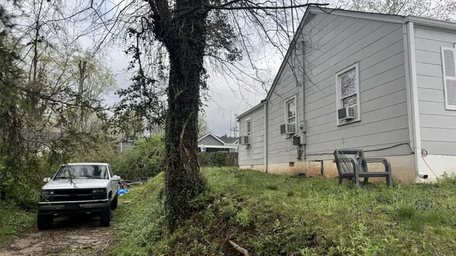 a view of a house with a back yard