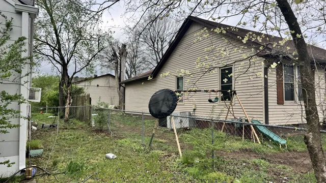 a backyard of a house with seating space