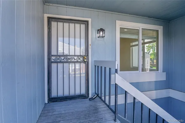 a view of entryway with wooden floor