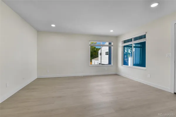 an empty room with windows