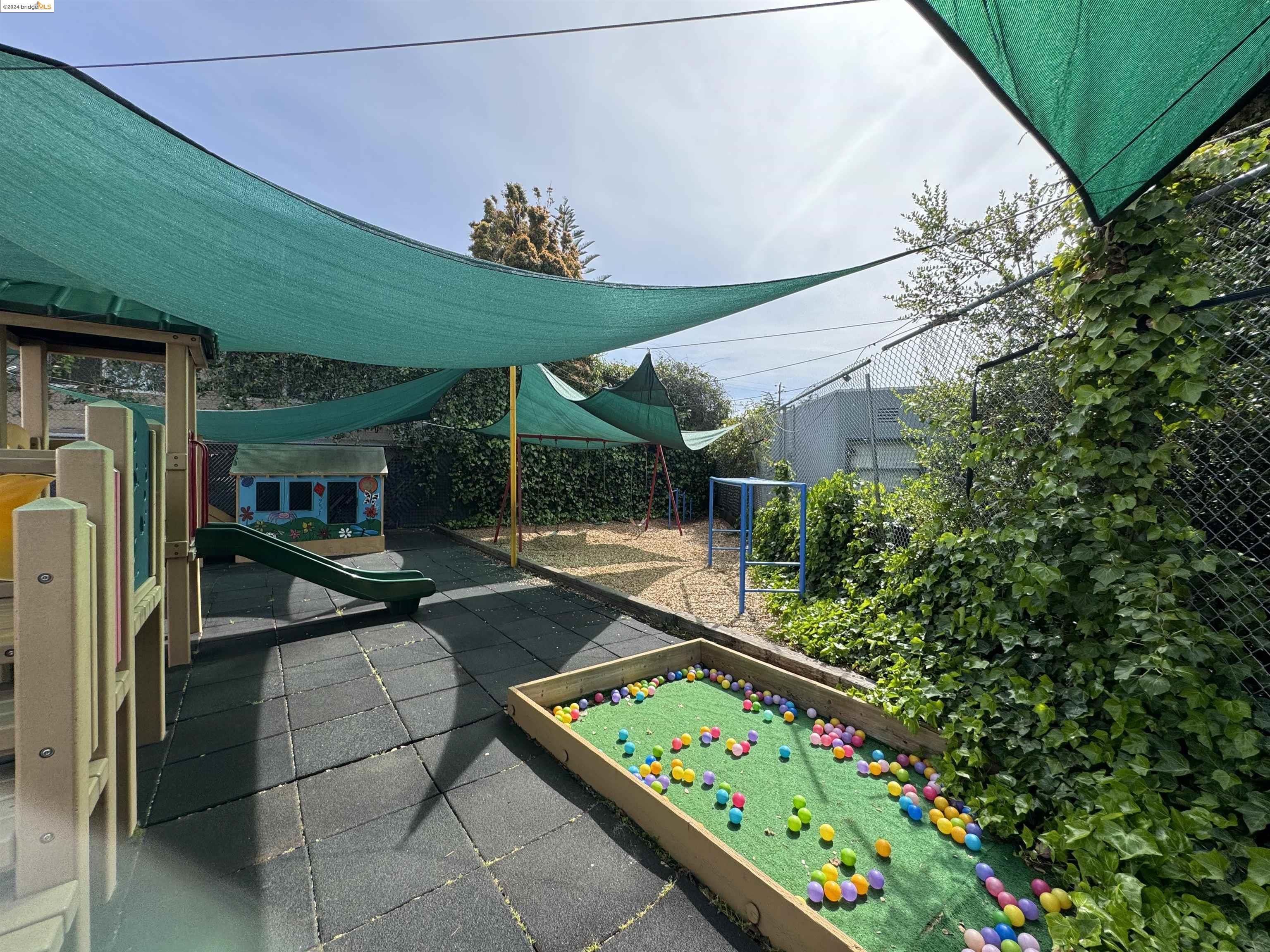 2330 Prince Street Berkeley, CA 94705 - Photo 44 of 55 a view of a patio with table and chairs under an umbrella