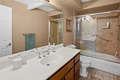 a bedroom with a bed and a night stand