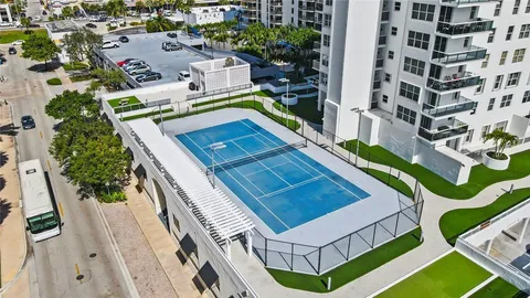a room with gym equipment and a large window