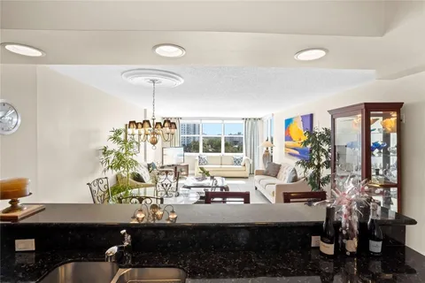 a kitchen with stainless steel appliances a sink and cabinets