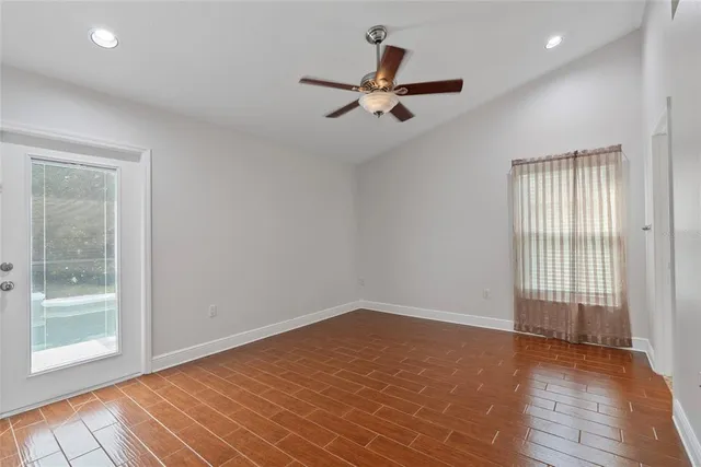 wooden floor in an empty room with a window